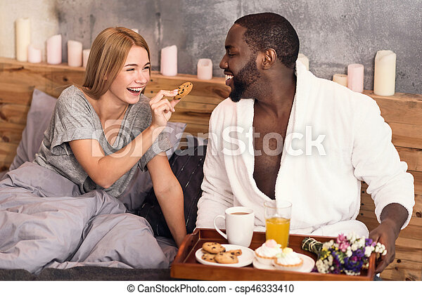 https://cdn.w600.comps.canstockphoto.com/joyful-international-couple-enjoying-picture_csp46333410.jpg